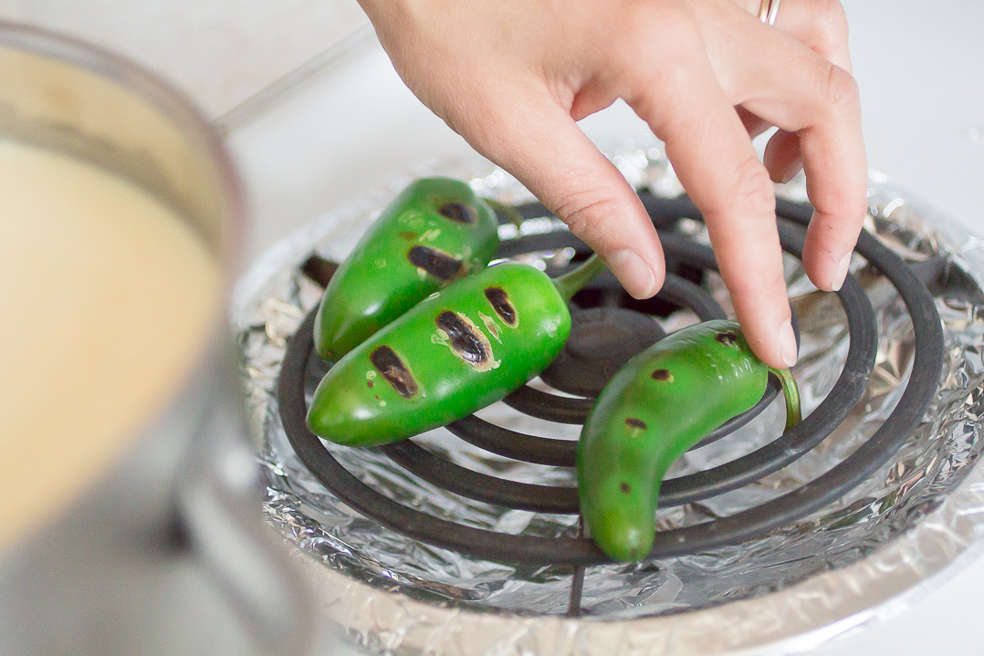 Roasting peppers over the stove.