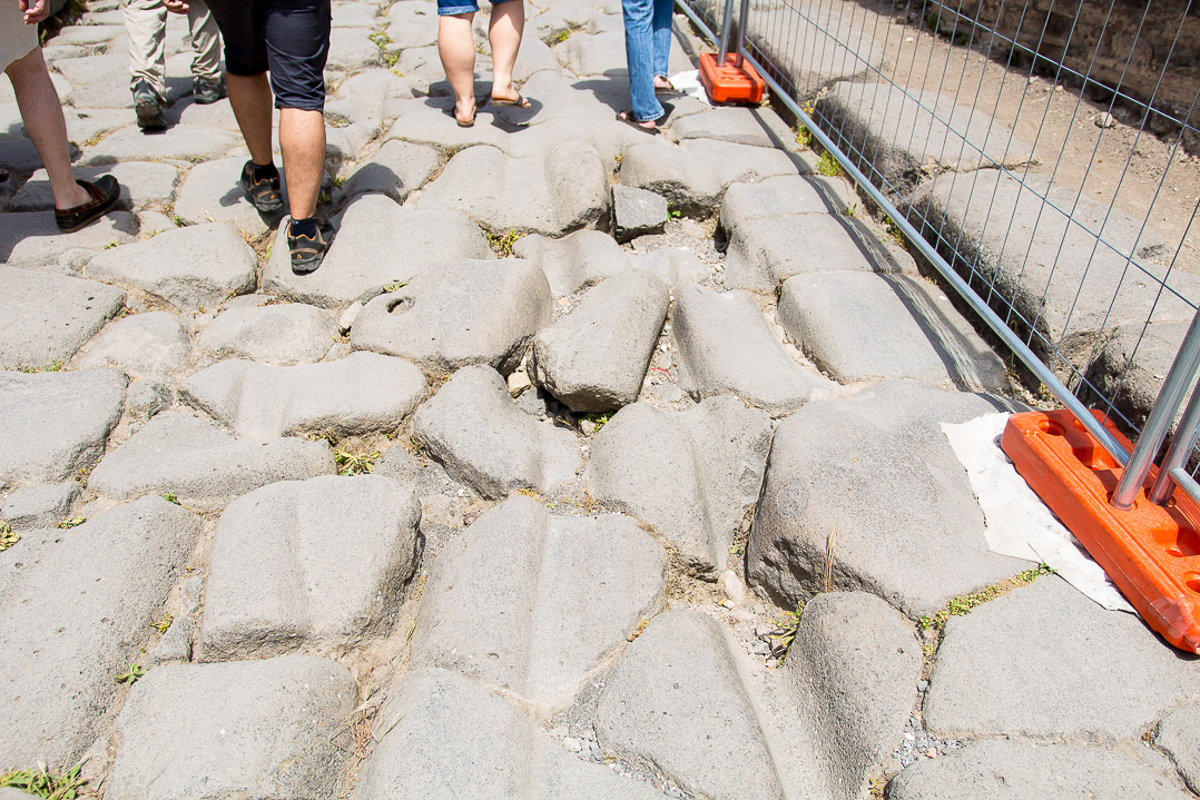 These wagon wheel grooves in the roads intrigued me to no end!  In Pompeii.