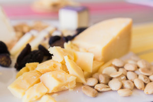 Cutting up harder cheeses lets people grab them with ease. An all Trader Joe's cheese plate on misscheesemonger.com.